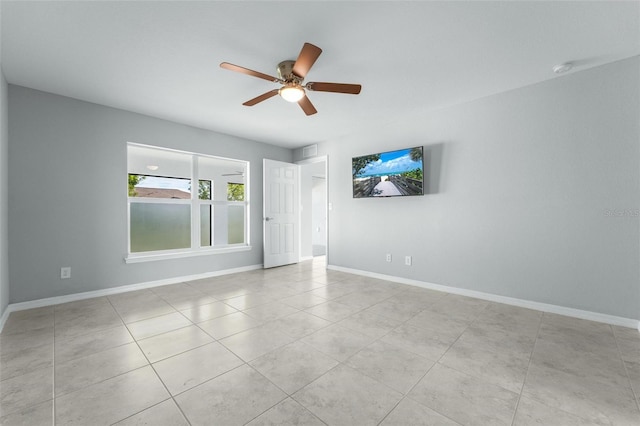 unfurnished room featuring light tile patterned floors and ceiling fan