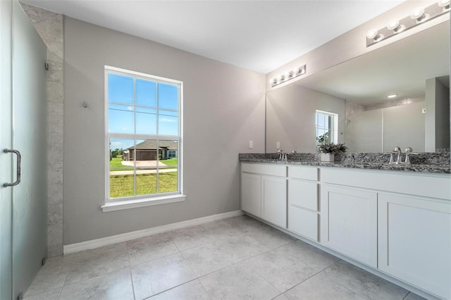 bathroom featuring double vanity and tile patterned floors