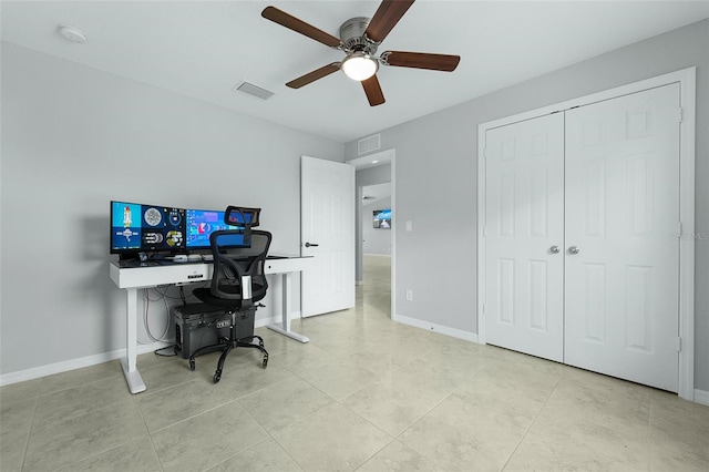 office with light tile patterned flooring and ceiling fan