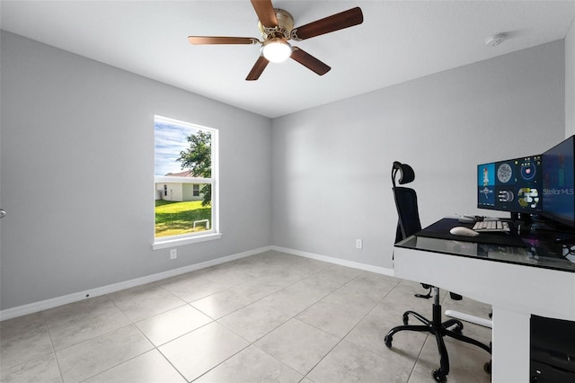 unfurnished office with light tile patterned floors and ceiling fan