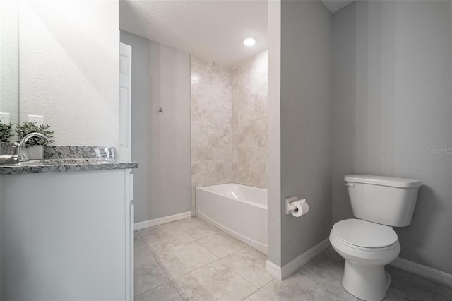 full bathroom featuring tile patterned floors, toilet, vanity, and tiled shower / bath