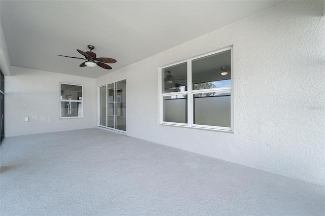 view of patio featuring ceiling fan