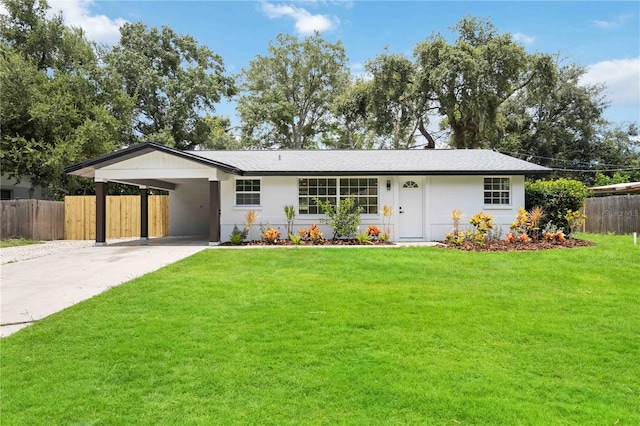 ranch-style house with a front lawn and a carport