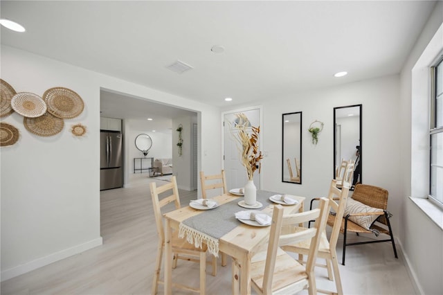 dining room with light wood-type flooring