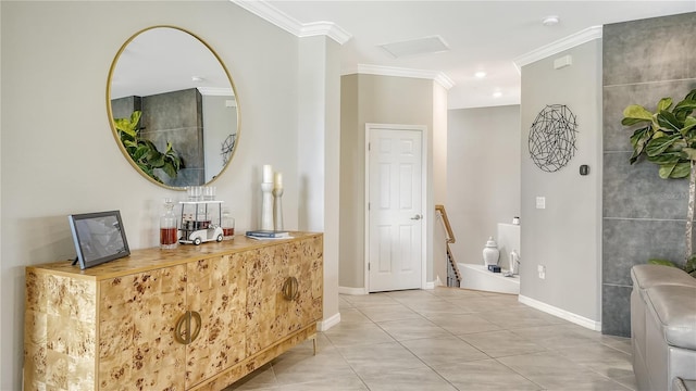 foyer entrance featuring light tile patterned floors and ornamental molding