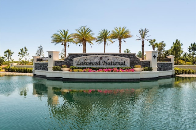 community sign with a water view