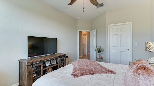 bedroom featuring ceiling fan and lofted ceiling