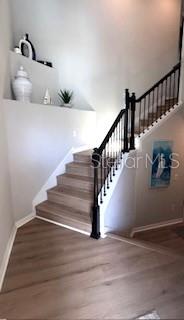 staircase featuring hardwood / wood-style flooring