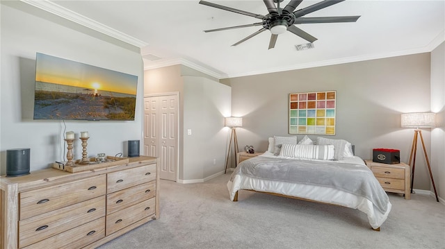 carpeted bedroom featuring a closet, ceiling fan, and ornamental molding