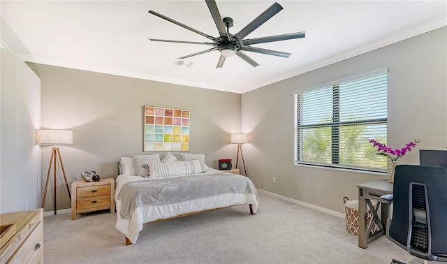 carpeted bedroom featuring ceiling fan and ornamental molding