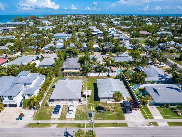 birds eye view of property with a residential view