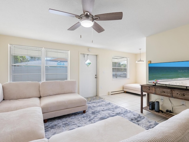 tiled living room featuring ceiling fan and a baseboard heating unit