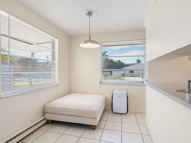 tiled bedroom featuring a baseboard radiator