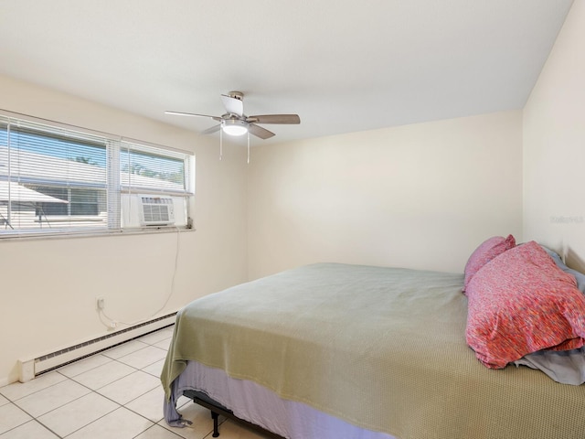 bedroom with a baseboard radiator, light tile patterned flooring, and ceiling fan