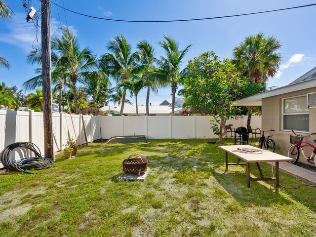 view of yard featuring a fire pit