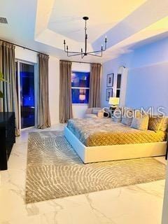 unfurnished bedroom featuring tile patterned floors, a raised ceiling, and a notable chandelier