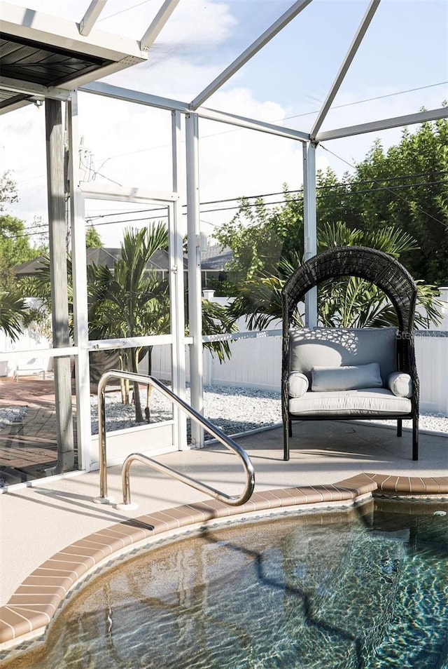 view of pool with a lanai and a patio area