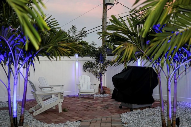 view of patio terrace at dusk