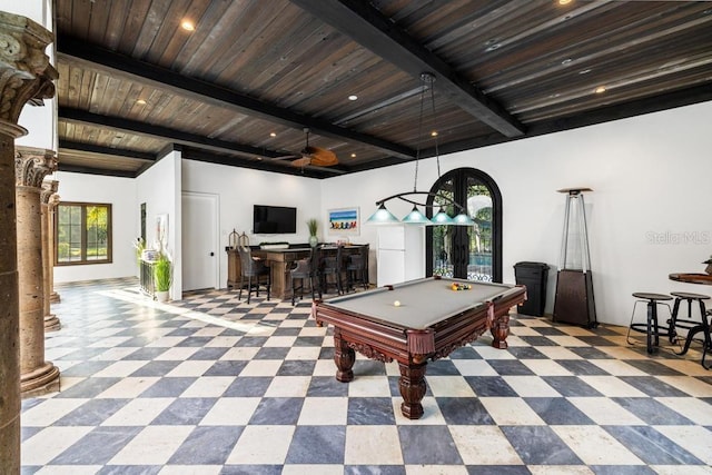 recreation room featuring wooden ceiling, billiards, ceiling fan, bar, and beam ceiling