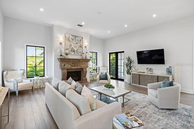 living room with french doors and hardwood / wood-style flooring