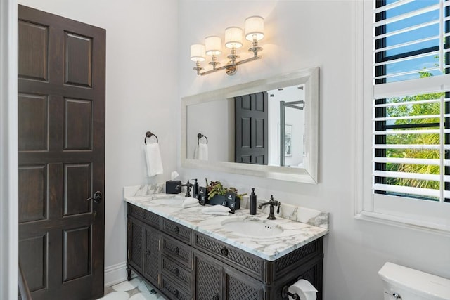 bathroom with vanity and toilet