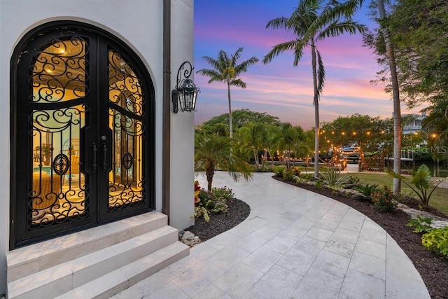 exterior entry at dusk with french doors