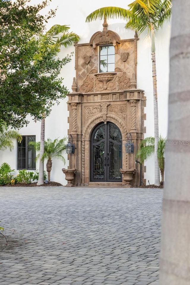 property entrance featuring french doors