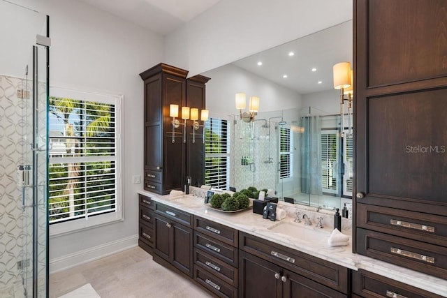 bathroom featuring lofted ceiling, vanity, and a shower with door