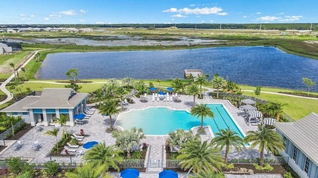 birds eye view of property with a water view