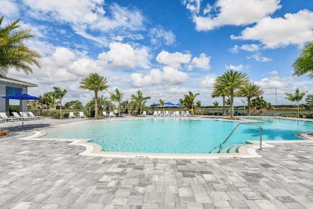 view of swimming pool with a patio area