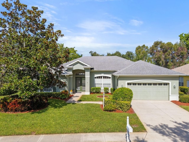 ranch-style home with a front yard and a garage