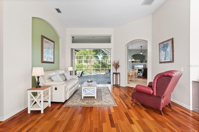 1206 86th Ct NW, Bradenton, FL 34209 - living room with arched walkways and wood finished floors
