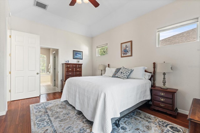1206 86th Ct NW, Bradenton, FL 34209 - bedroom with wood finished floors, ceiling fan, and connected bathroom