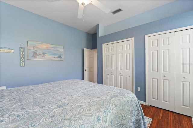 1206 86th Ct NW, Bradenton, FL 34209 - bedroom with multiple closets, dark wood finished floors, and a ceiling fan