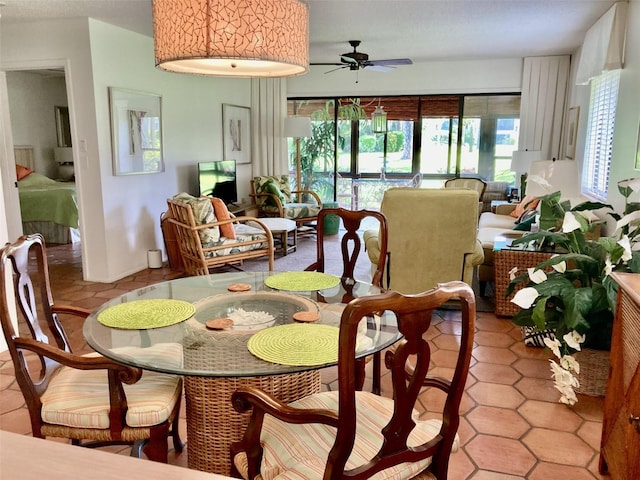 dining area featuring light tile patterned floors and ceiling fan