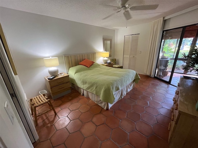 bedroom with access to exterior, ceiling fan, a closet, and a textured ceiling