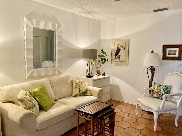 living room featuring a textured ceiling