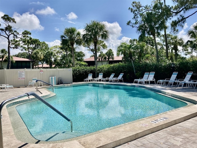 view of swimming pool with a patio