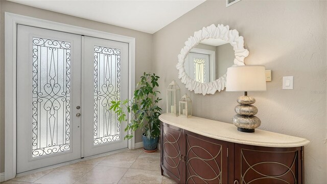 tiled foyer entrance with french doors