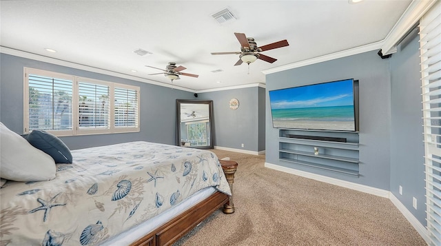 bedroom featuring ceiling fan, crown molding, and carpet floors