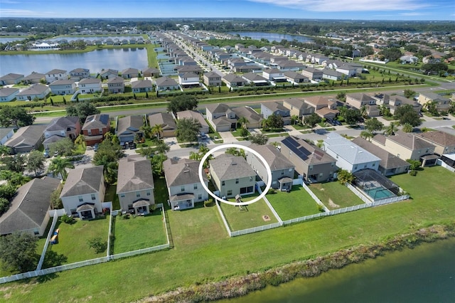 aerial view featuring a residential view and a water view