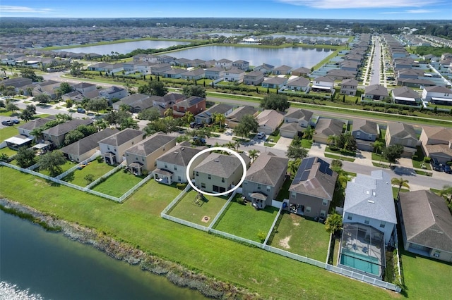 birds eye view of property featuring a residential view and a water view