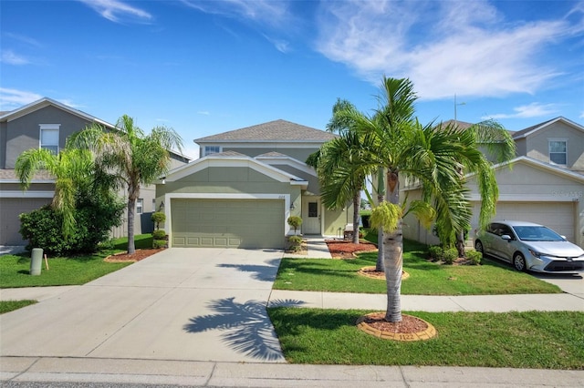 view of front of house featuring a garage, a front yard, and concrete driveway