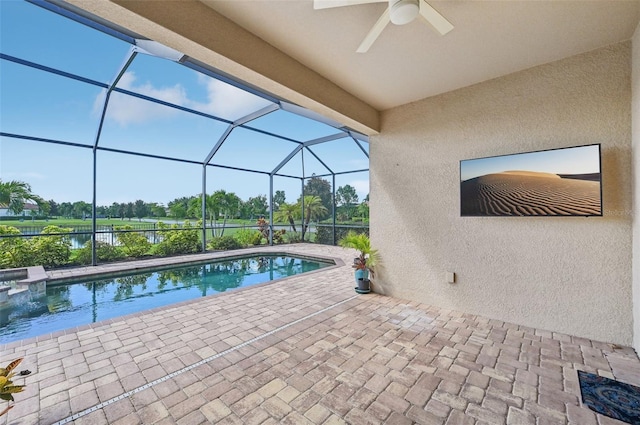 view of swimming pool featuring a lanai and a patio