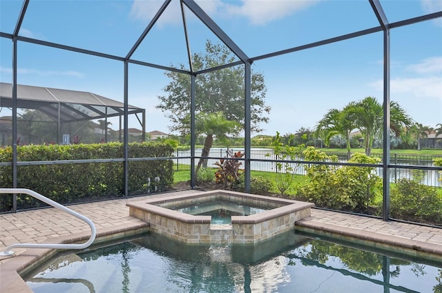 view of swimming pool featuring an in ground hot tub and glass enclosure