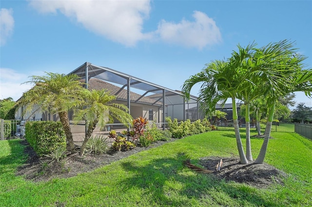 view of yard featuring glass enclosure