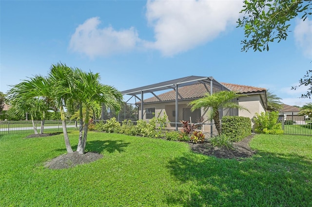 exterior space with a yard and a lanai