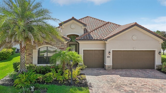 mediterranean / spanish house featuring a garage