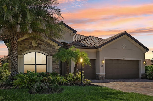 mediterranean / spanish house featuring a garage