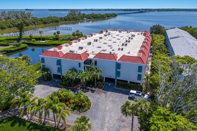 birds eye view of property with a water view